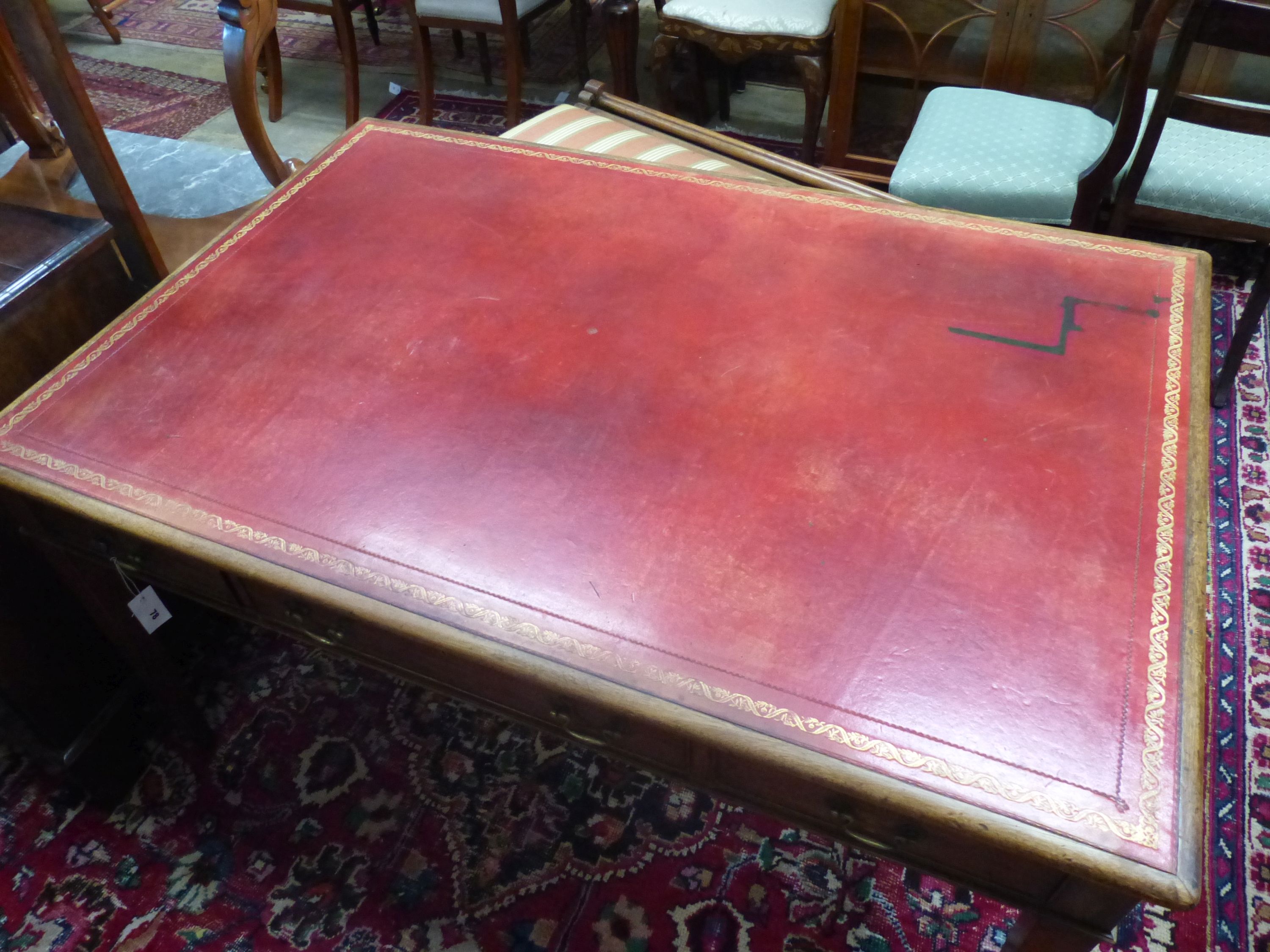 A George III style rectangular mahogany writing table, width 136cm, depth 91cm, height 75cm